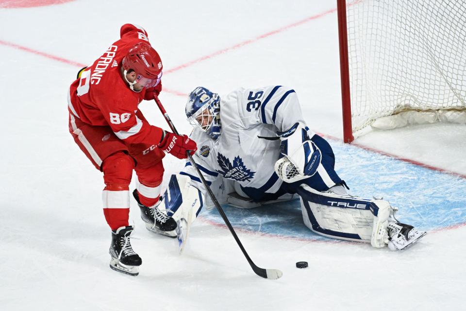 Forward Daniel Sprong of the Detroit Red Wings shoots past goaltender Ilya Samsonov of Toronto on a penalty shot during the NHL Global Series game between the Toronto Maple Leafs and the Detroit Red Wings at Avicii Arena in Stockholm, Sweden, on Friday, Nov. 17, 2023.