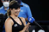 Danielle Collins of the U.S. smiles as she is interviewed after defeating Iga Swiatek of Poland in their semifinal match at the Australian Open tennis championships in Melbourne, Australia, Thursday, Jan. 27, 2022. (AP Photo/Hamish Blair)