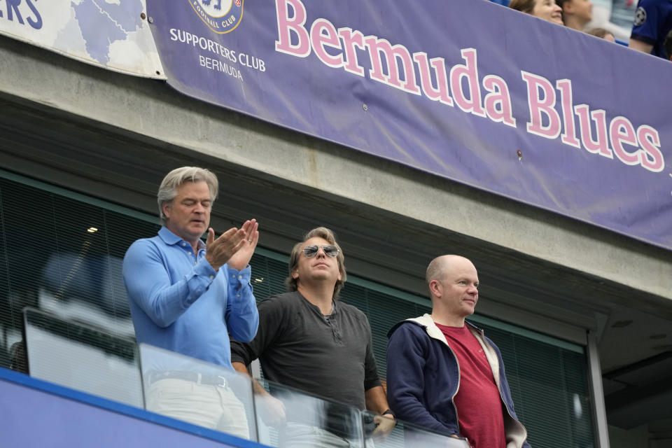 Chelsea new owner Todd Boehly, center, stands during the English Premier League soccer match between Chelsea and Wolverhampton at Stamford Bridge stadium, in London, Saturday, May 7, 2022. (AP Photo/Frank Augstein)