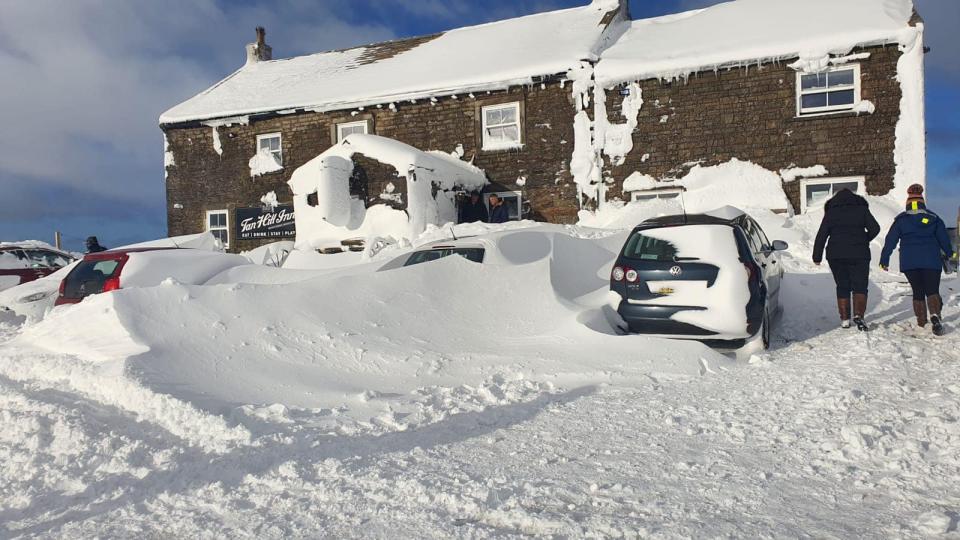 Guests and staff have been trapped at the Tan Hill Inn since Friday when snow drifted up the walls of the building. (PA)