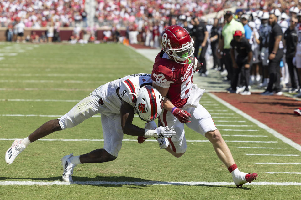Oklahoma wide receiver Gavin Freeman (82) runs in for a touchdown as Arkansas State safety Trevian Thomas (9) tackles during the first half of an NCAA college football game, Saturday, Sept. 2, 2023, in Norman, Okla. (AP Photo/Alonzo Adams)