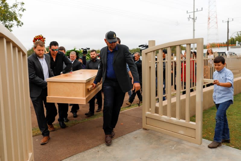 Relatives of Christina Marie Langford Johnson, who was killed by unknown assailants, carry her coffin during the funeral service before a burial at the cemetery in LeBaron, Chihuahua