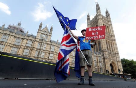 FILE PHOTO: A man holds an anti-Brexit banner on Westminster Bridge, in central London, Britain, July 13, 2018. REUTERS/Yves Herman/File Photo