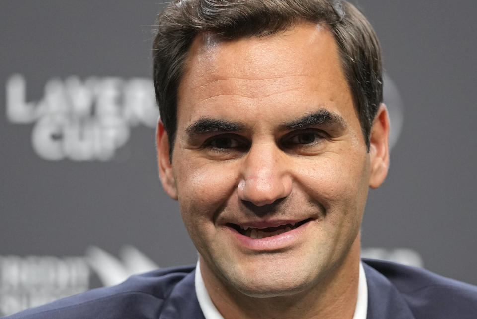 Switzerland's Roger Federer smiles during a media conference ahead of the Laver Cup tennis tournament at the O2 in London, Wednesday, Sept. 21, 2022. Federer will meet with the media Wednesday to discuss walking away from the game at age 41 after 20 Grand Slam titles. (AP Photo/Kin Cheung)