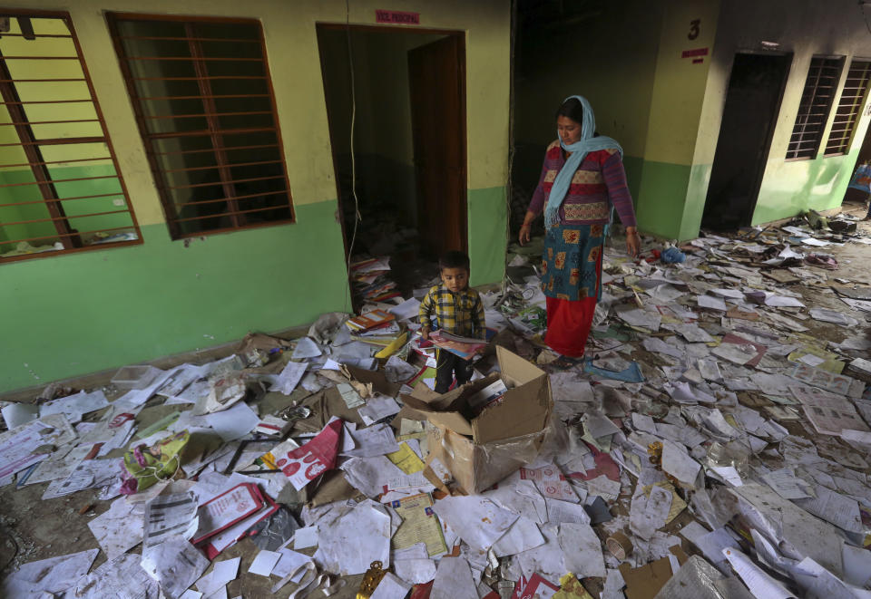 Books lie scattered at the Rajdhani Public School which was vandalized in Tuesday's violence at Shiv Vihar in New Delhi, India, Wednesday, Feb. 26, 2020. More than 20 people were killed in three days of clashes in New Delhi, with the death toll expected to rise as hospitals were overflowed with dozens of injured people, authorities said Wednesday. The clashes between Hindu mobs and Muslims protesting a contentious new citizenship law that fast-tracks naturalization for foreign-born religious minorities of all major faiths in South Asia except Islam escalated Tuesday. (AP Photo)