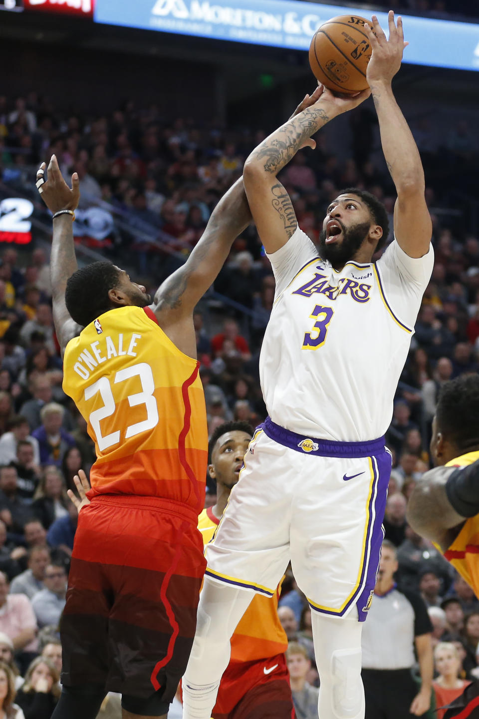 Los Angeles Lakers forward Anthony Davis (3) shoots as Utah Jazz forward Royce O'Neale (23) defends in the first half during an NBA basketball game Wednesday, Dec. 4, 2019, in Salt Lake City. (AP Photo/Rick Bowmer)