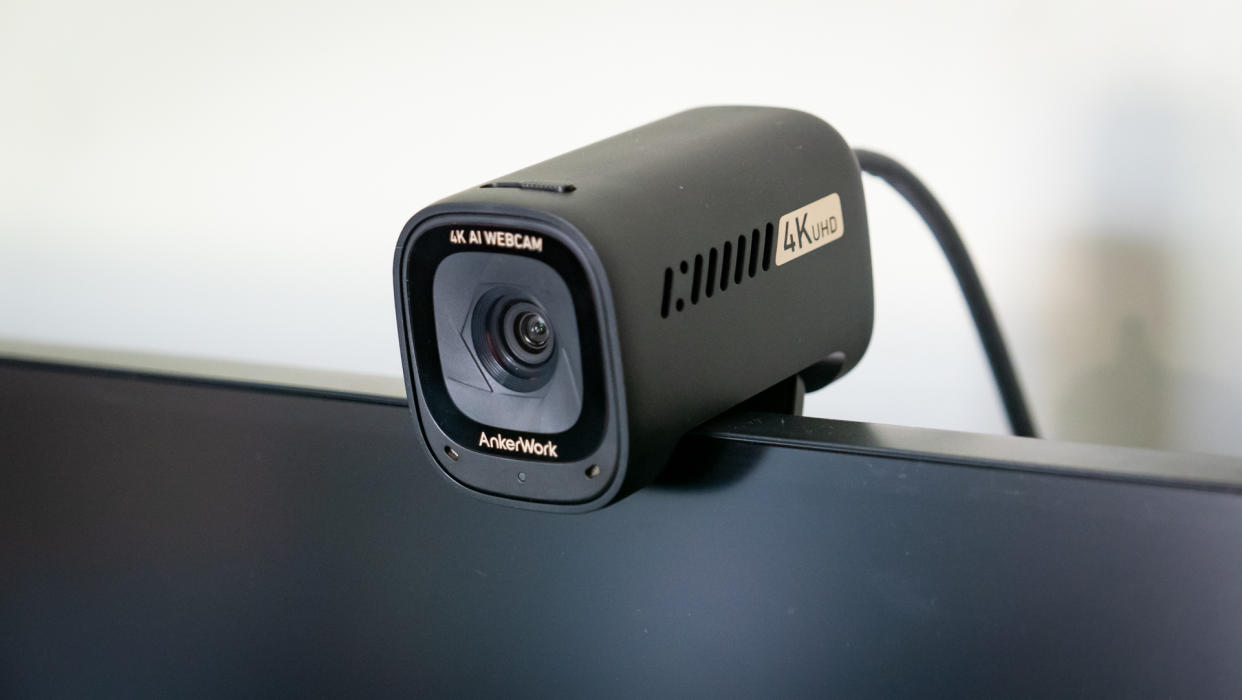 AnkerWork C310 webcam mounted on top of a monitor screen. 