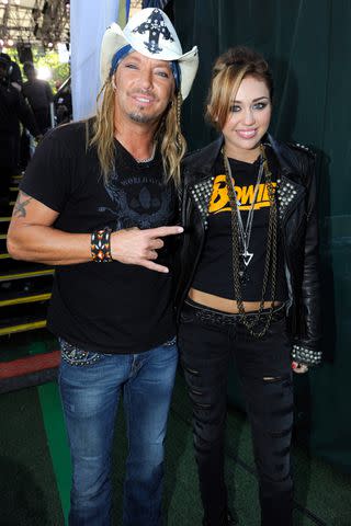 <p>Kevin Mazur/Getty</p> Bret Michaels and Miley Cyrus in 2010