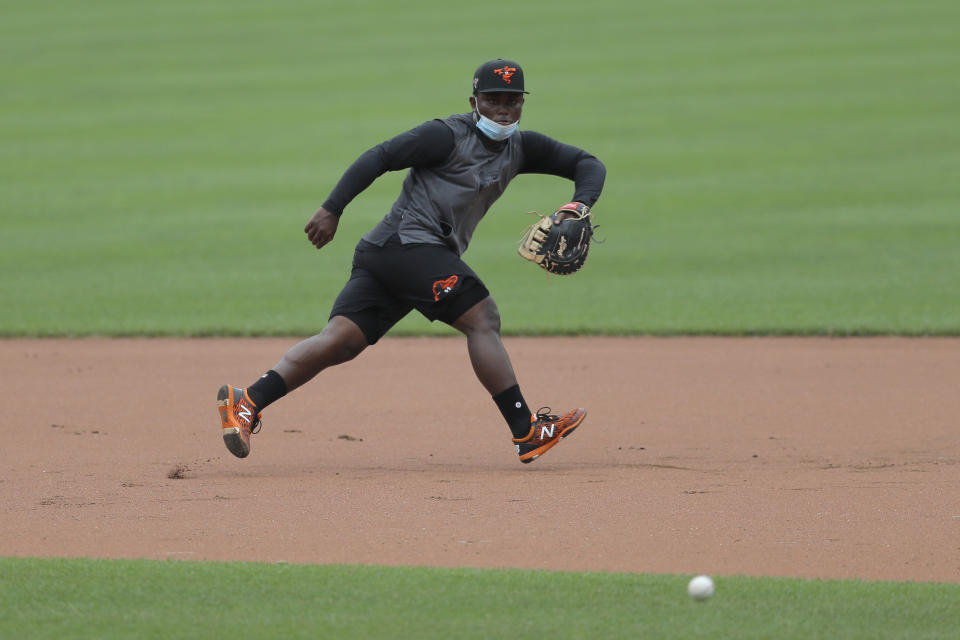 Baltimore Orioles infielder Dilson Herrera fields a ground ball during baseball training camp, Tuesday, July 7, 2020, in Baltimore. (AP Photo/Julio Cortez)