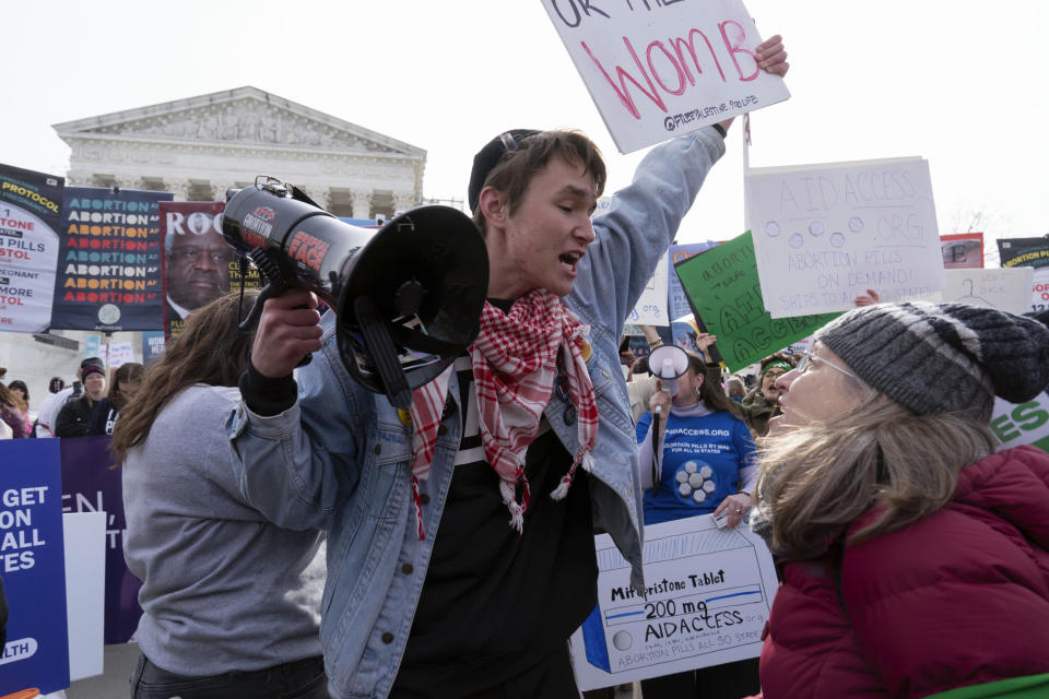 Anti-abortion and abortion rights activists, rally outside the Supreme Court, Tuesday, March 26, 2024, in Washington. The Supreme Court is hearing arguments in its first abortion case since conservative justices overturned the constitutional right to an abortion two years ago. At stake in Tuesday's arguments is the ease of access to a medication used last year in nearly two-thirds of U.S. abortions. (AP Photo/Jose Luis Magana)