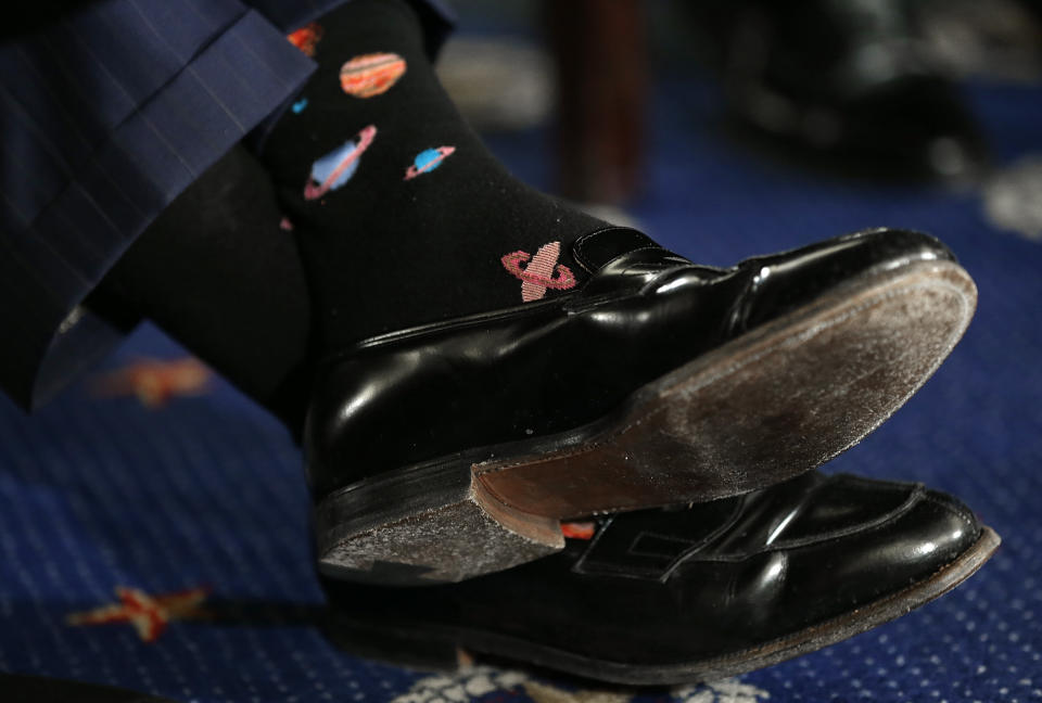 The socks of former NASA astronaut Buzz Aldrin are shown as he testifies before the Senate Space, Science, and Competitiveness Subcommittee on Capitol Hill on Feb. 24, 2015.