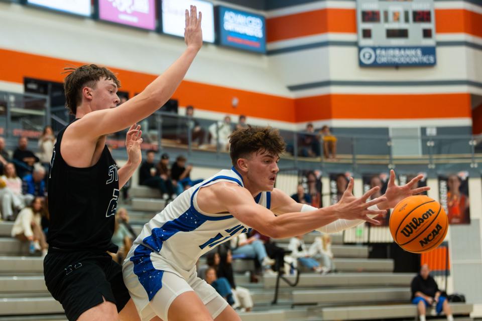 Right to left, Herriman High School’s Cale Barclay defends Dixie High School’s Logan Weidauer during a boys basketball semifinal game of the Allstate Falcon Classic at Skyridge High School in Lehi on Friday, Dec. 8, 2023. | Megan Nielsen, Deseret News