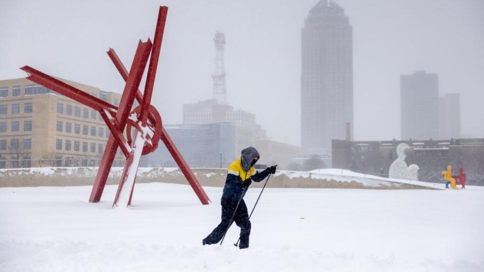 A cross-country skier at the Sculpture Park during a winter storm ahead of the Iowa caucus in Des Moines, Iowa