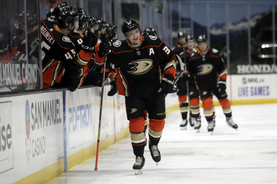Anaheim Ducks right wing Jakob Silfverberg (33) celebrates with teammates after scoring against the Colorado Avalanche during the first period of an NHL hockey game in Anaheim, Calif., Sunday, Jan. 24, 2021. (AP Photo/Alex Gallardo)