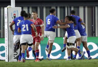 Samoan players celebrate the try by Ed Fidow during the Rugby World Cup Pool A game between Russia and Samoa at Kumagaya Rugby Stadium, Kumagaya City, Japan, Tuesday, Sept. 24, 2019. (AP Photo/Jae Hong)