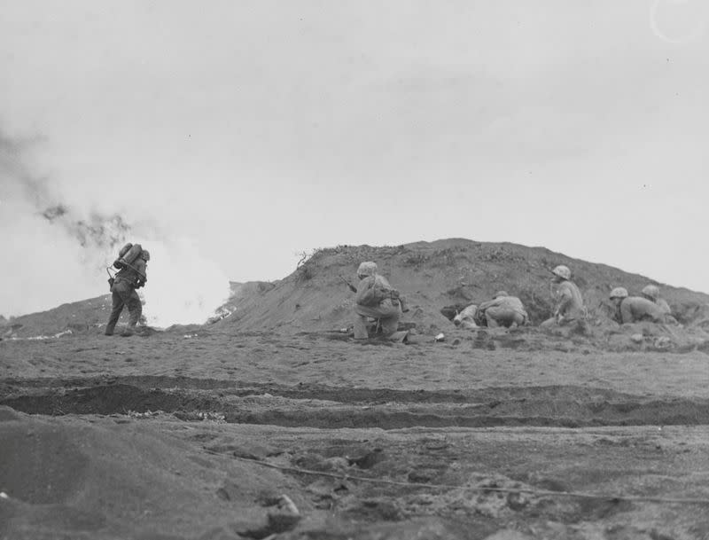 A U.S. Marine fires a flame-thrower during operations on Iwo Jima