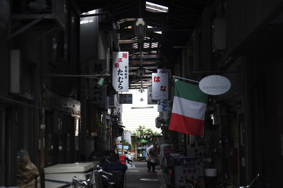 A back street ally with bars and restaurant is seen at downtown Tokyo Tuesday, June 23, 2020. Japan’s economy is opening cautiously, with social-distancing restrictions amid the coronavirus pandemic. (AP Photo/Eugene Hoshiko)