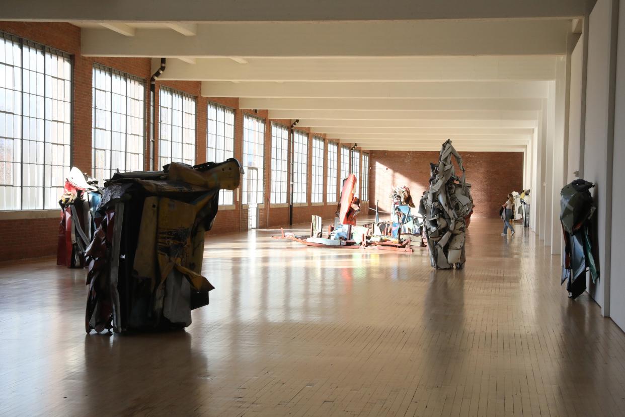 Visitors make their way through works by John Chamberlain on display at DIA Beacon on November 16, 2020. 