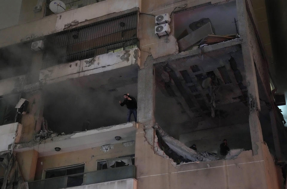 A man screams from inside a destroyed apartment following a massive explosion in the southern suburb of Beirut, Lebanon, Tuesday, Jan. 2, 2024. The TV station of Lebanon's Hezbollah group says top Hamas official Saleh Arouri was killed Tuesday in an explosion in a southern Beirut suburb.(AP Photo/Hussein Malla)