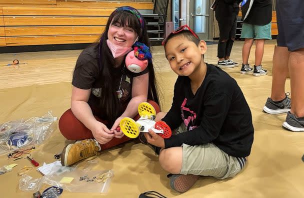 PHOTO: Danielle Boyer builds a robot car with a student using the robotics kit she invented, Every Kid Gets a Robot. (Danielle Boyer)