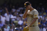 San Diego Padres starting pitcher Yu Darvish wipes his face as he walks back to the dugout after the third inning of a baseball game against the Los Angeles Dodgers Sunday, Aug. 7, 2022, in Los Angeles. (AP Photo/Mark J. Terrill)