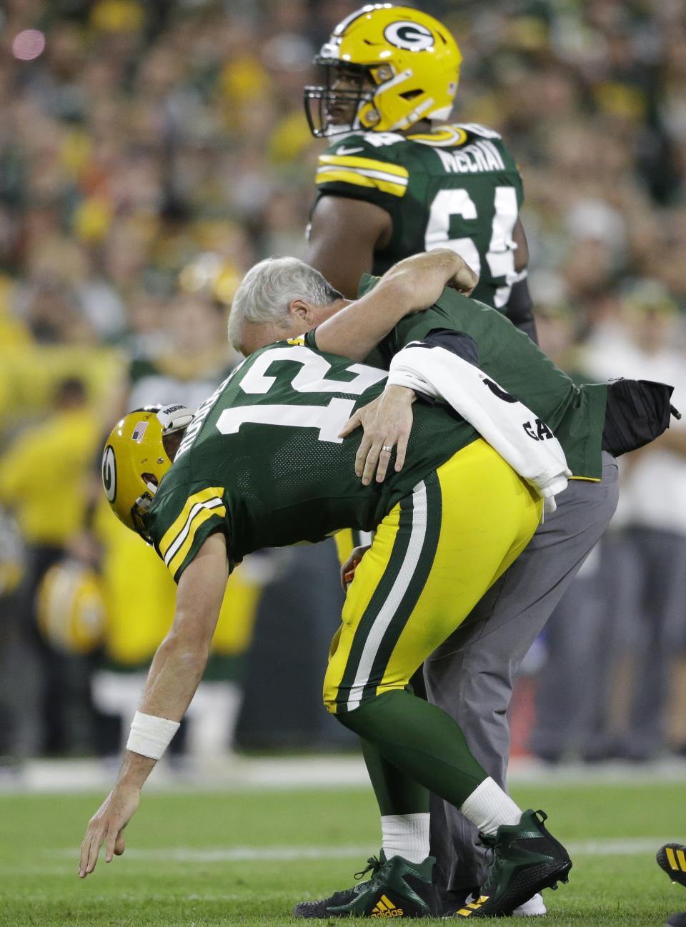 Green Bay Packers quarterback Aaron Rodgers is hurt after being sacked during the first half of an NFL football game against the Chicago Bears Sunday, Sept. 9, 2018, in Green Bay, Wis. (AP Photo/Jeffrey Phelps)