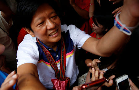 Philippines Vice-Presidential candidate BongBong Marcos arrives at Saint Louis University during an election campaign in the mountain resort of Baguio city in northern Philippines April 16, 2016. REUTERS/Erik De Castro