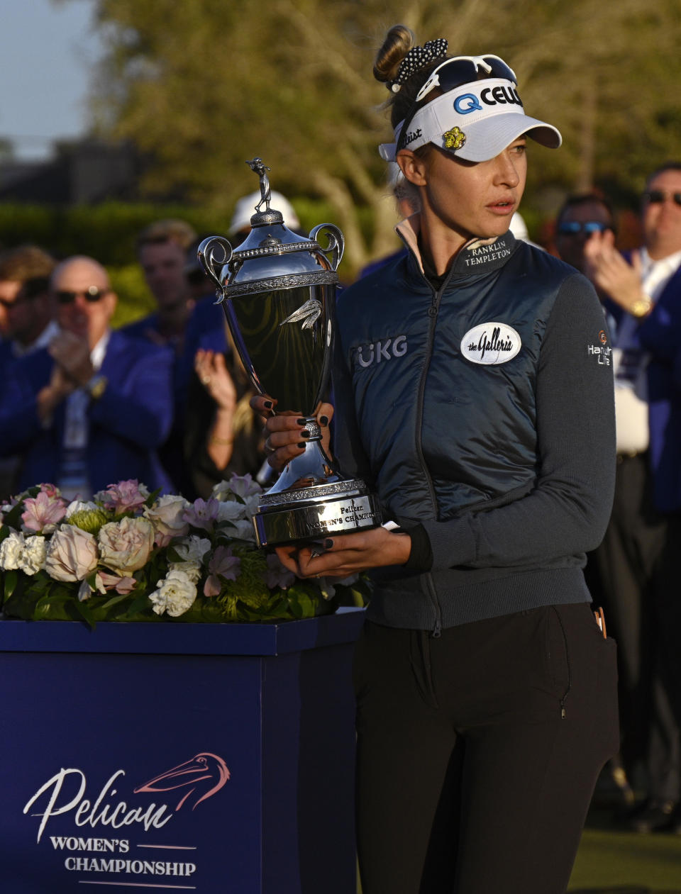 Nelly Korda holds the winner's trophy after a one-stroke victory in sudden-death in the LPGA Pelican Women's Championship golf tournament at Pelican Golf Club, Sunday, Nov. 14, 2021, in Belleair, Fla. (AP Photo/Steve Nesius)