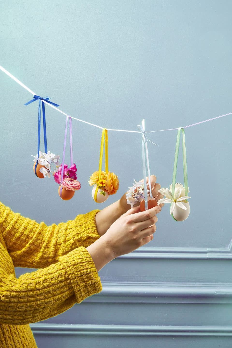 <p>This colorful egg-shell garland is an Easter party must-have. Plus, it's so easy to make!</p><p><strong><em>Get the tutorial at <a href="https://www.goodhousekeeping.com/holidays/easter-ideas/g711/easter-spring-crafts/?slide=27" rel="nofollow noopener" target="_blank" data-ylk="slk:Good Housekeeping;elm:context_link;itc:0;sec:content-canvas" class="link ">Good Housekeeping</a>.</em></strong></p><p><strong><a class="link " href="https://www.amazon.com/LaRibbons-Solid-Ribbon-Colors-Package/dp/B009V35YVC/?tag=syn-yahoo-20&ascsubtag=%5Bartid%7C10070.g.1751%5Bsrc%7Cyahoo-us" rel="nofollow noopener" target="_blank" data-ylk="slk:SHOP SATIN RIBBON;elm:context_link;itc:0;sec:content-canvas">SHOP SATIN RIBBON</a></strong></p>