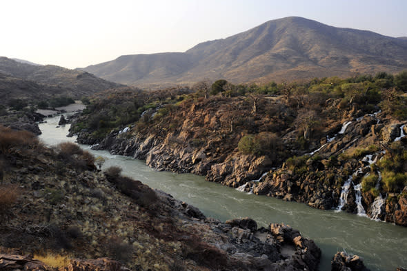 A general view taken on August 21, 2010 shows the Kunene river near the Epupa falls in northern Namibia at the border with Angola. In 2007,  Angola and Namibia pledged they would go ahead with a huge hydro power project on the Kunene river, which forms the common border between the two countries. AFP PHOTO / STEPHANE DE SAKUTIN (Photo credit should read STEPHANE DE SAKUTIN/AFP/Getty Images)