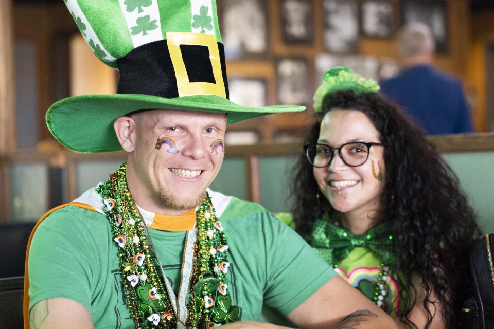 Patrick Basham and Alex Da Luz enjoy their beer and food at Padre Murphy's Irish pub in Phoenix.