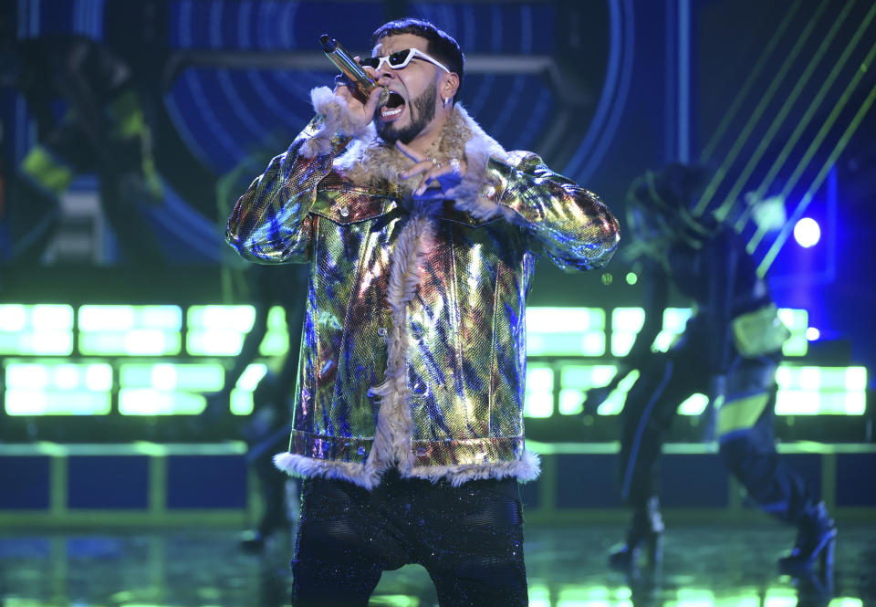 FILE - Anuel AA performs at the Latin American Music Awards in Los Angeles on Oct. 17, 2019. The Puerto Rican rapper-singer is nominated for seven Latin Grammy Awards including one for best new artist. (Photo by Chris Pizzello/Invision/AP, File)