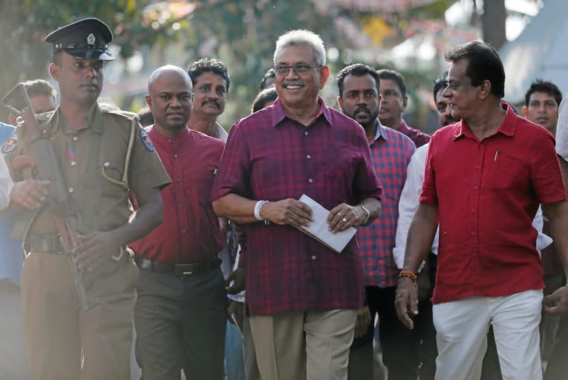 Sri Lanka People's Front party presidential election candidate and former wartime defence chief Rajapaksa leaves after casting his vote during the presidential election in Colombo