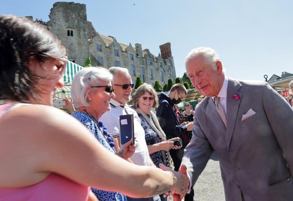 Prince Charles, Prince of Wales meets with members of the public during a visit to Hay Castle