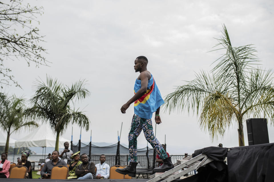 A model presents clothes made by Maguy Mbaka Guy from Kinshasa during the ninth edition of the Liputa fashion show in Goma, Democratic Republic of Congo, Saturday June 24, 2023. The objective of the show, involving designers, models and artists from DRC, Cameroon, Central African Republic, Senegal, Burundi, France, United States and others, is to reveal the latest trends, but also to deliver a message of peace and peaceful coexistence during a period of high tension between the DRC and Rwanda, accused by Kinshasa of supporting the M23 rebellion in the east of country. (AP Photo/Moses Sawasawa)