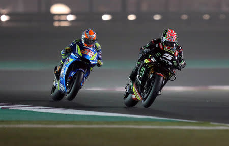 Motorcycle Racing - Qatar Motorcycle Grand Prix - MotoGP Second Qualifying Session - Losail, Qatar, March 17, 2018 - Team Suzuki Ecstar rider Alex Rins of Spain and Monster Yamaha Tech 3 rider Johann Zarco of France compete. REUTERS/Ibraheem Al Omari