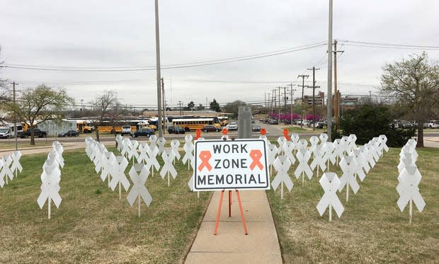 Ribbon-shape markers were placed outside the Oklahoma Department of Transportation building to symbolize the people who have lost their lives in work zone accidents.