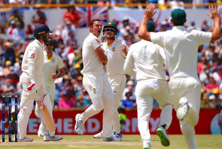 Cricket - Australia v England - Ashes test match - WACA Ground, Perth, Australia, December 17, 2017 - Australia's Josh Hazlewood celebrates with team mates after dismissing England's Mark Stoneman during the fourth day of the third Ashes cricket test match. REUTERS/David Gray