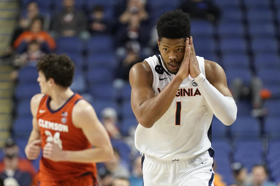 Virginia forward Jayden Gardner (1) gestures after making a 3-point basket against Clemson during the second half of an NCAA college basketball game at the Atlantic Coast Conference Tournament in Greensboro, N.C., Friday, March 10, 2023. (AP Photo/Chuck Burton)