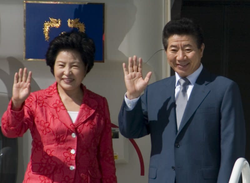 Roh Moo-hyun, president of South Korea, (R) and his wife, Kwon Yang, wave to Korean-American community leaders before departing from Boeing Field in Seattle on July 1, 2007. Linked to a corruption investigation, Roh killed himself on this day in 2009. File Photo by Jim Bryant/UPI