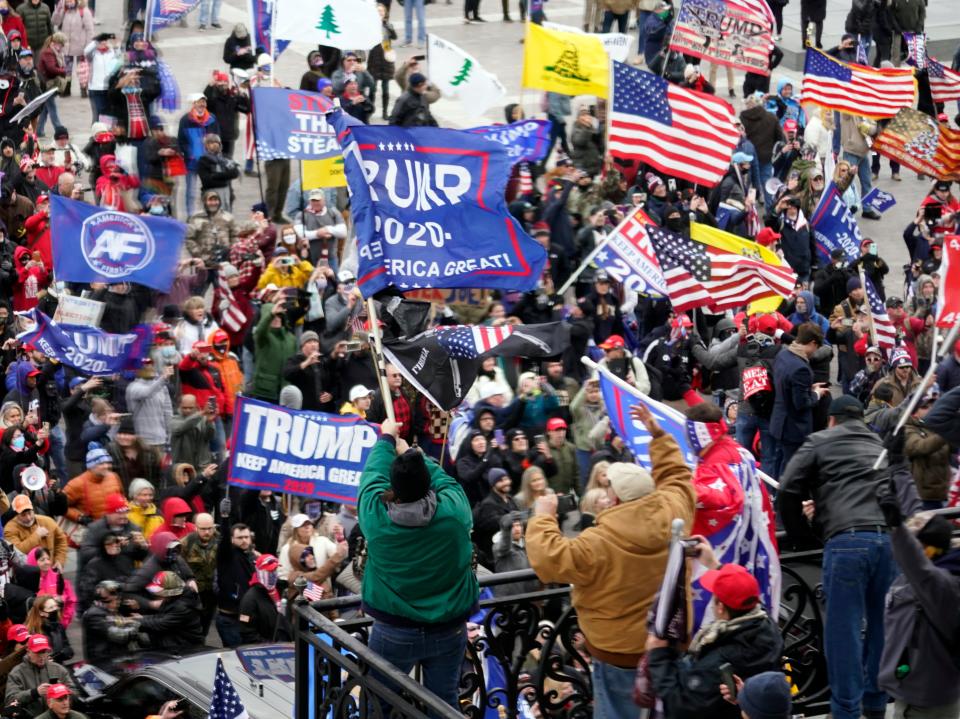 <p>Violent protesters gather outside the US Capitol in Washington on 6 January, 2021</p> (AP)