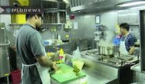 In this photo released by state-run IRIB News Agency, which aired on Monday, July 22, 2019, shows cooks in the galley of the British-flagged tanker Stena Impero that was seized by Tehran in the Strait of Hormuz on Friday. The Associated Press cannot independently verify the condition of the crew members, but in the video they looked to be in good health and it didn't appear as though they were being filmed under duress. (IRIB News Agency via AP)