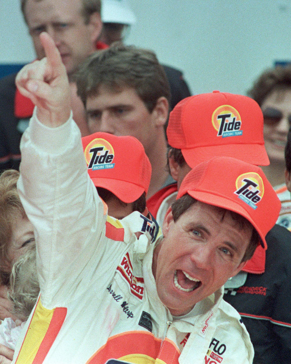 FILE - In this Feb. 19, 1989, file photo, Darrell Waltrip celebrates in Victory Lane after winning the Daytona 500 auto race in Daytona Beach, Fla. Waltrip will soon Boogity! Boogity! Boogity! his way into retirement. Everyone yearns for an opportunity to say farewell on their own terms, so with that, Waltrip should bring his second career as a NASCAR broadcaster to a close and squeeze out his classic catchphrase on his own terms as Fox Sports closes its portion of the broadcast deal. (AP Photo/Doug Jennings, File)