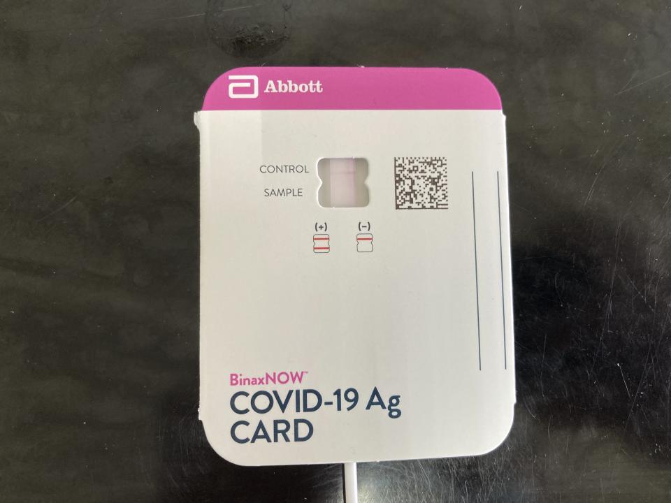 A COVID-19 test kit shows a negative result on Tuesday, Feb. 14, 2023, at Truman Lake Manor in Lowry City, Mo., Each day, every employee and visitor who enters the nursing home must first test negative for COVID-19. The nursing home requires the tests both for people who are unvaccinated and those who are vaccinated against the virus. (AP Photo/David A. Lieb)