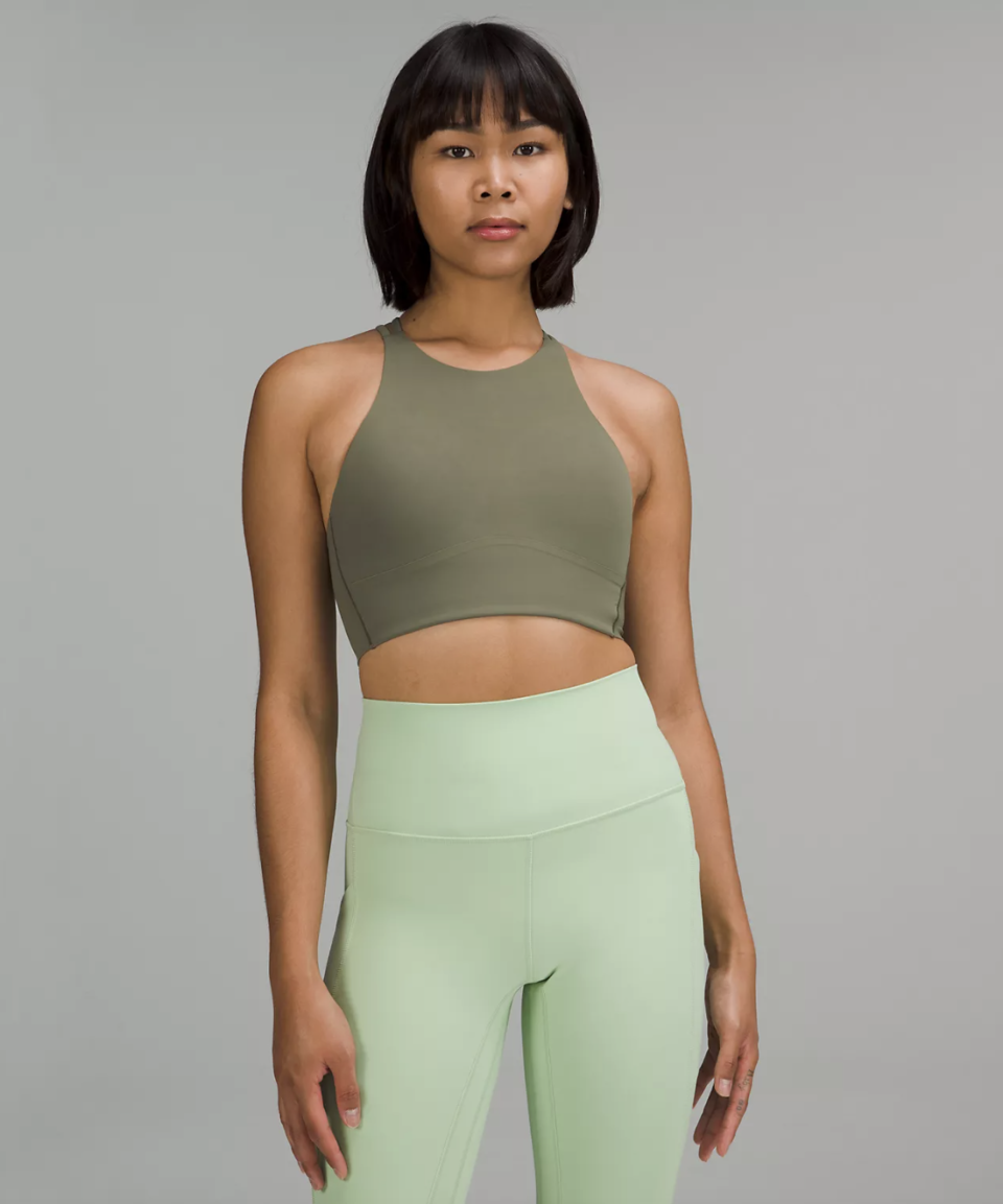 woman in green leggings and green Like a Cloud High-Neck Longline Bra in medium olive (Photo via Lululemon)