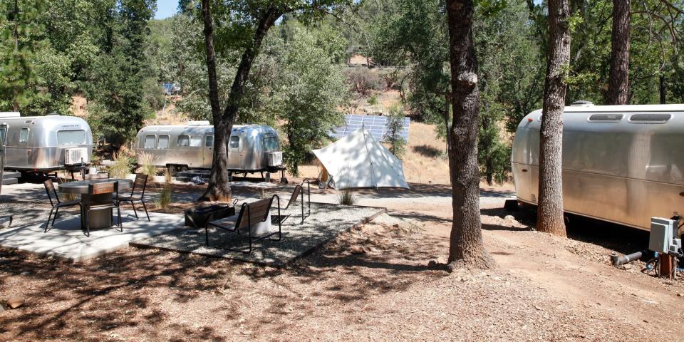 Autocamp Yosemite's Airstream suites by trees and walkways