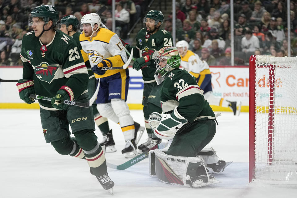 Minnesota Wild goaltender Filip Gustavsson (32) watches play during the second period of the team's NHL hockey game against the Nashville Predators on Sunday, Feb. 19, 2023, in St. Paul, Minn. (AP Photo/Abbie Parr)