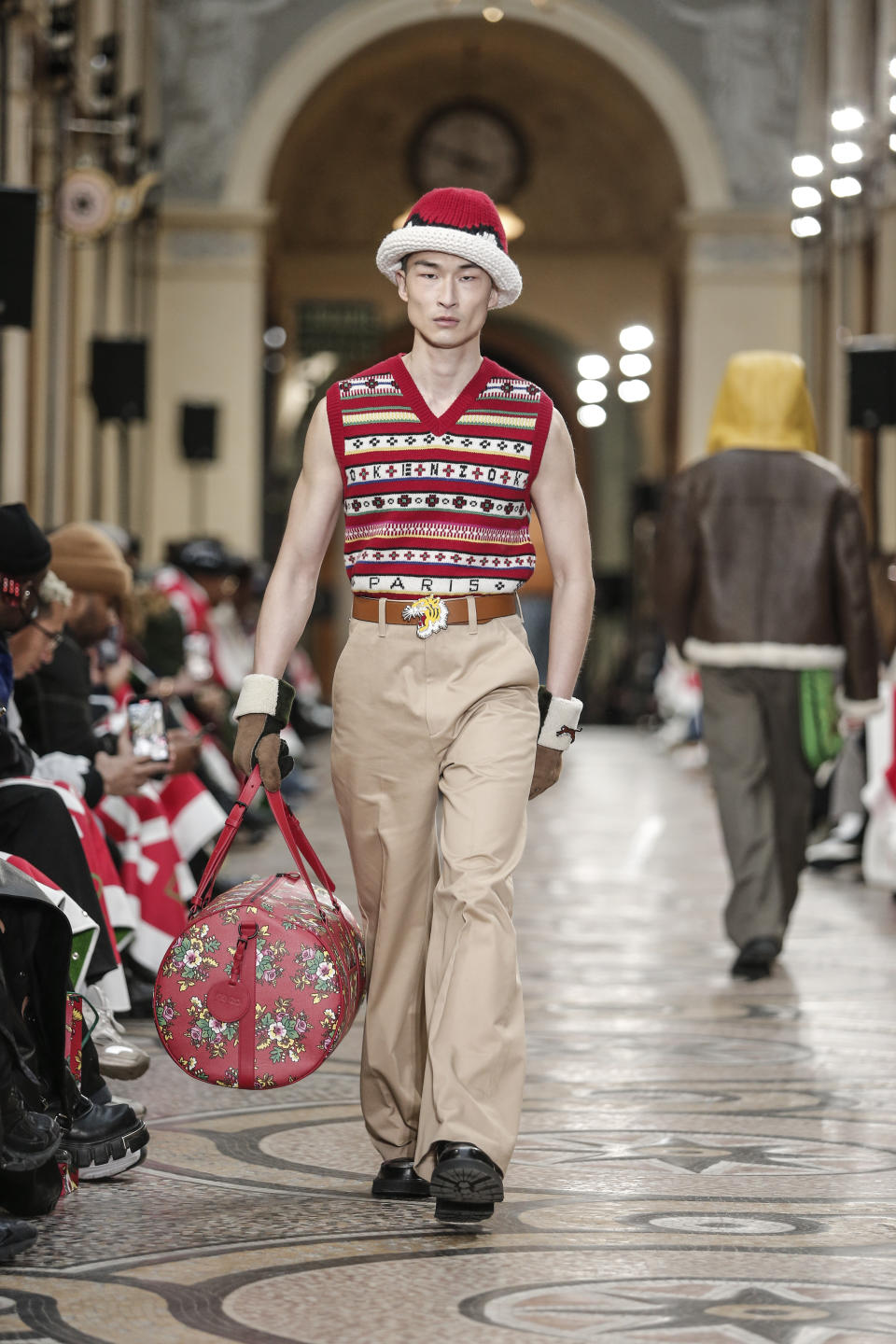 A model wears a creation for the Kenzo fall-winter 22/23 men's collection, in Paris, Sunday, Jan. 23, 2022. (AP Photo/Lewis Joly)