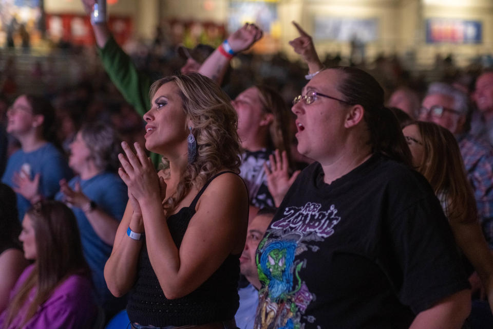 A crowd member sings along Friday night at the Clovis Music Festival in Clovis, New Mexico.
