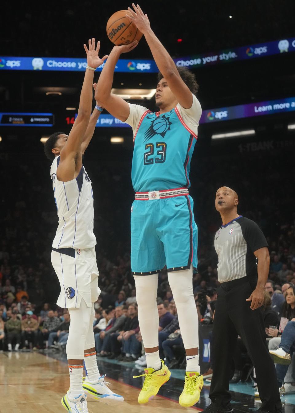 Jan 26, 2023; Phoenix, Arizona, USA; Phoenix Suns forward 	Cameron Johnson (23) shoots the ball over Dallas Mavericks guard Spencer Dinwiddie (26) at Footprint Center. Mandatory Credit: Joe Rondone-Arizona Republic